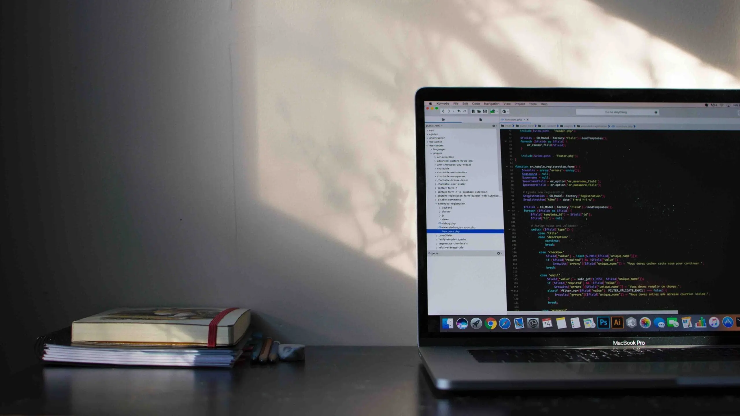 laptop computer with code editor