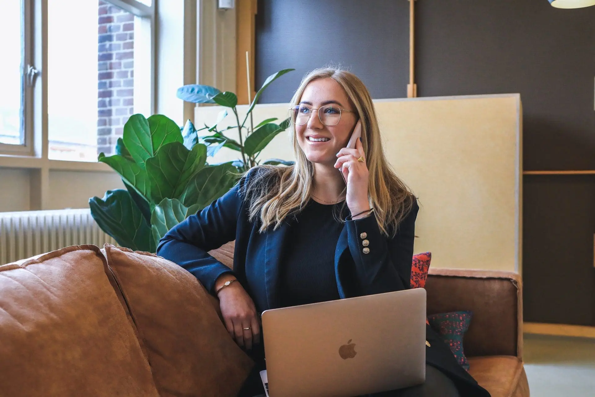 a smiling woman talking on the phone