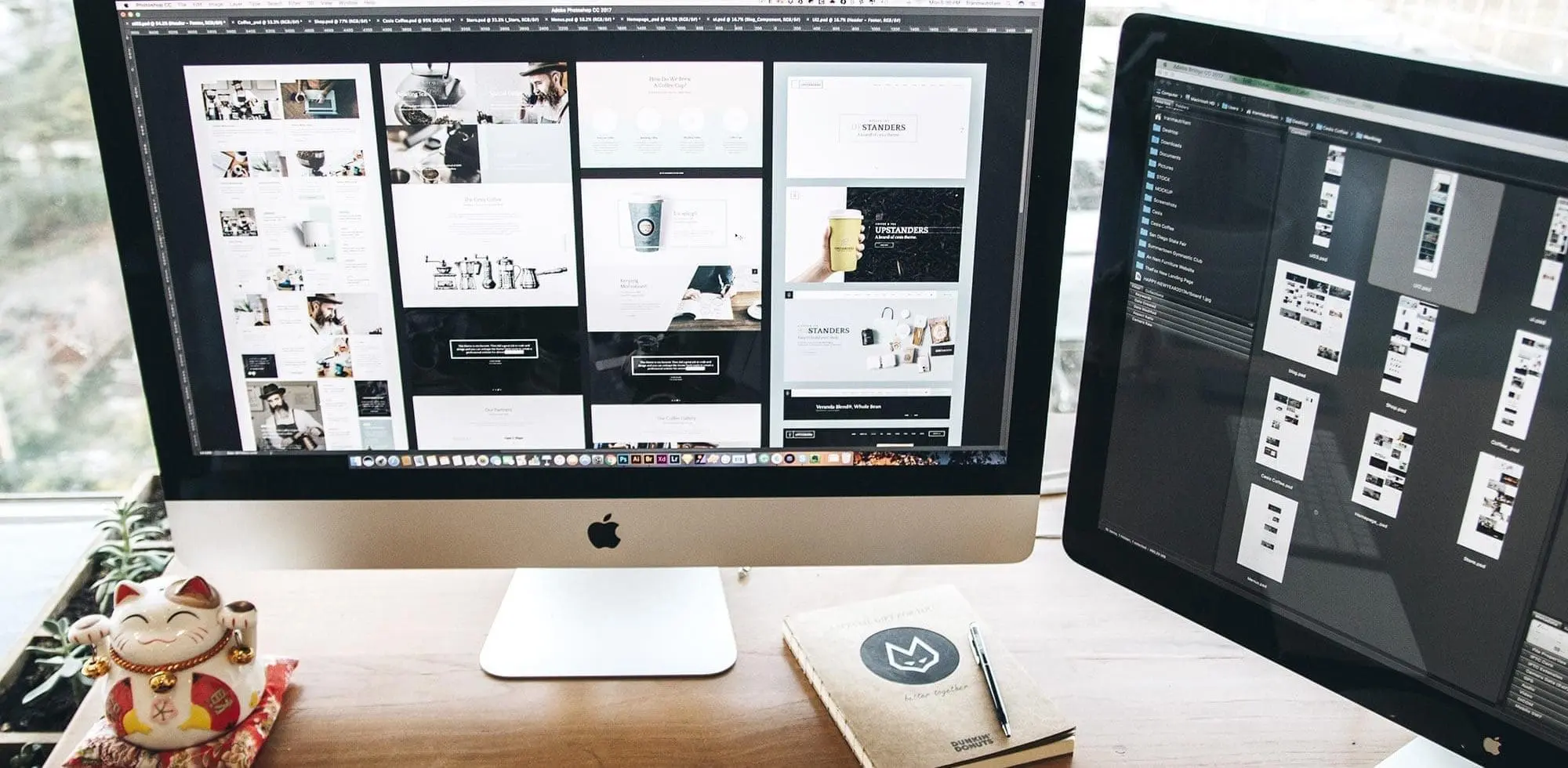 two desktop monitors with mockups on screen
