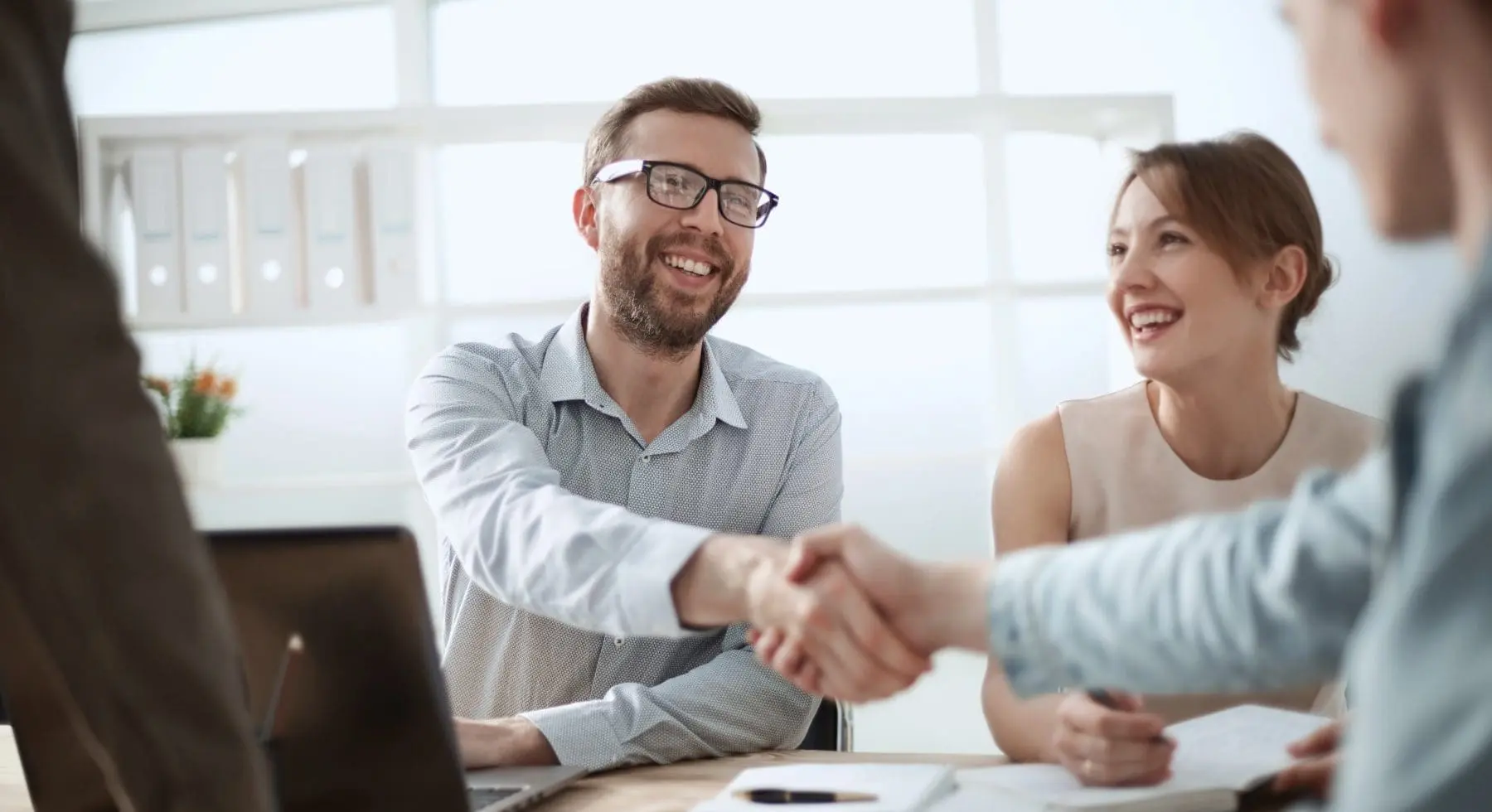 a person shaking hands with another person