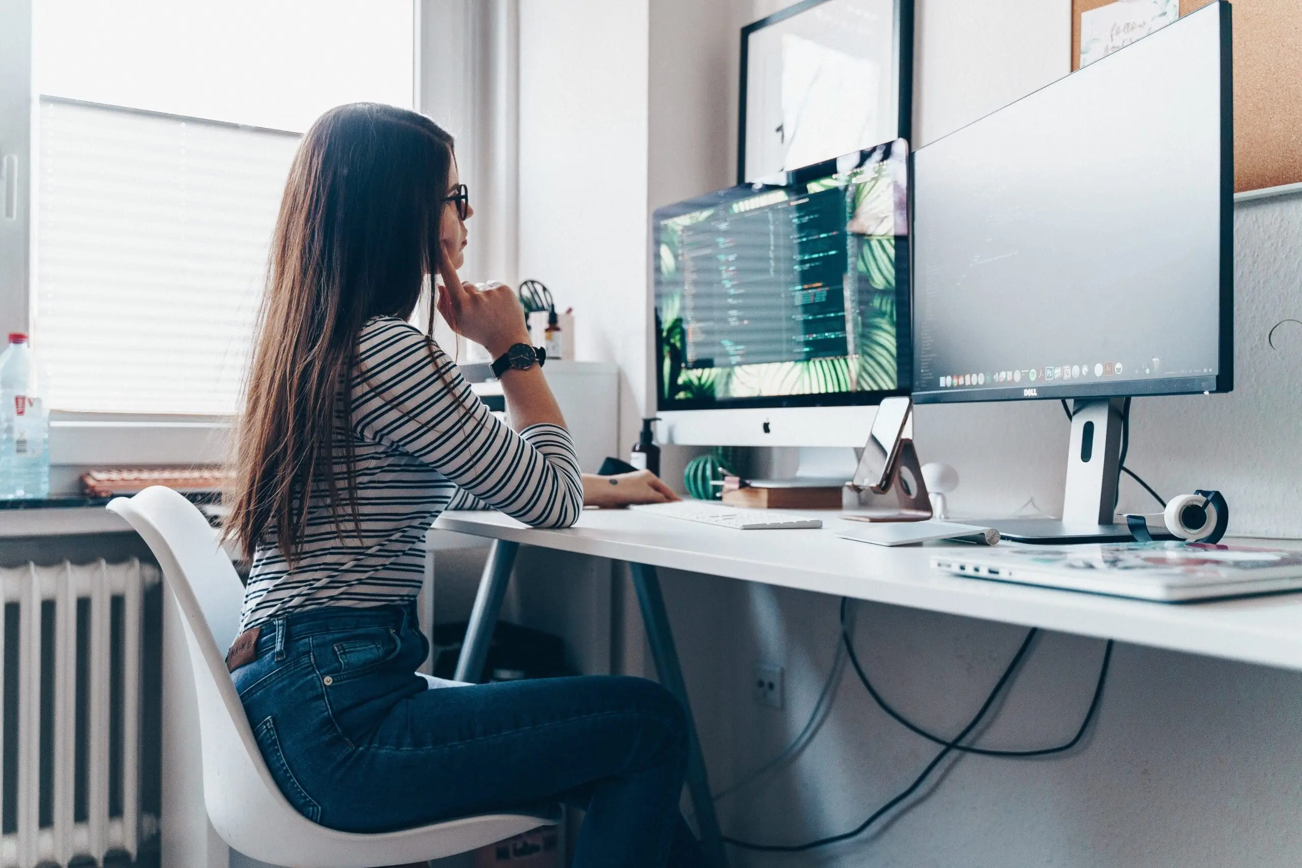 a woman in front of desktop
