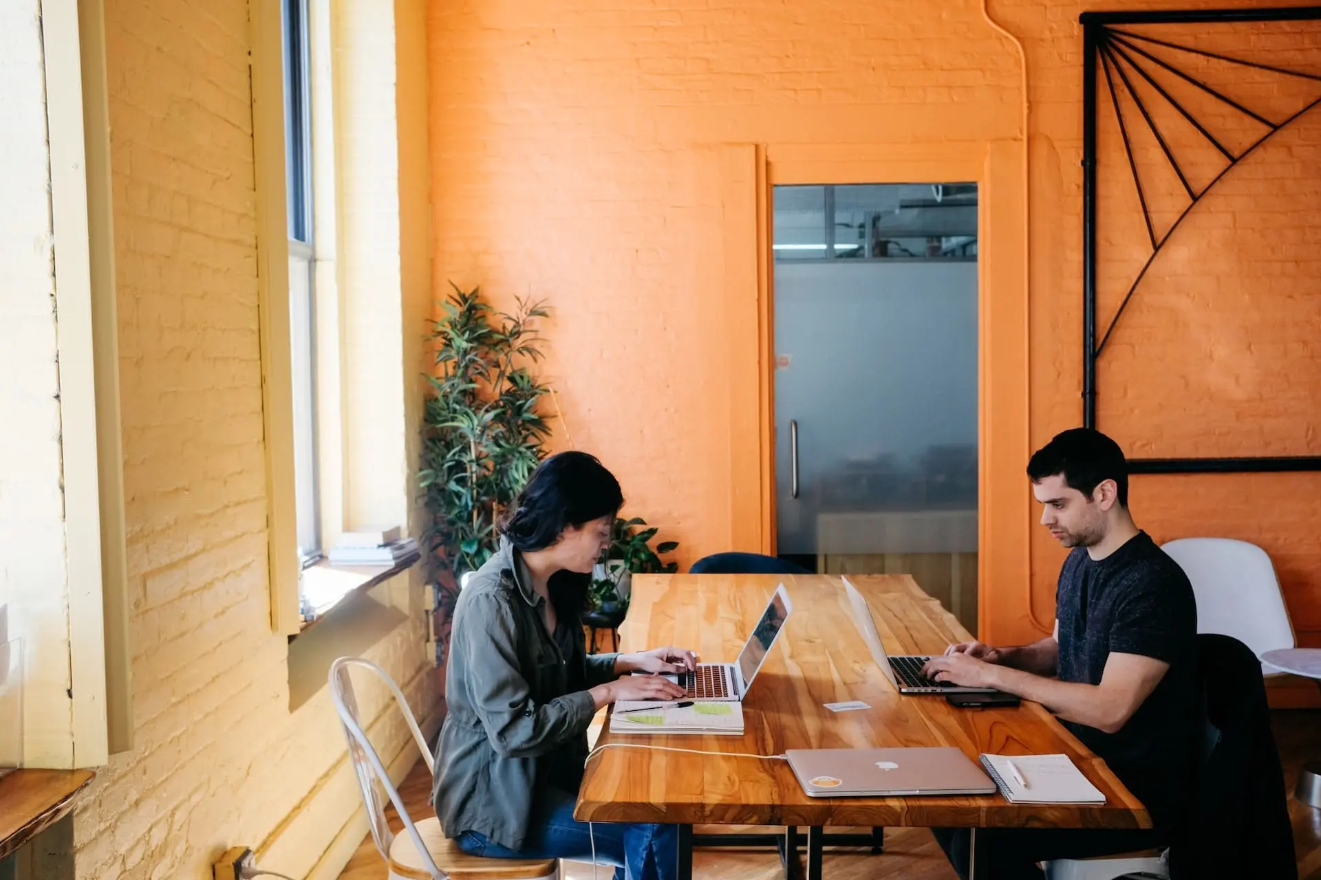 2 persons using laptop