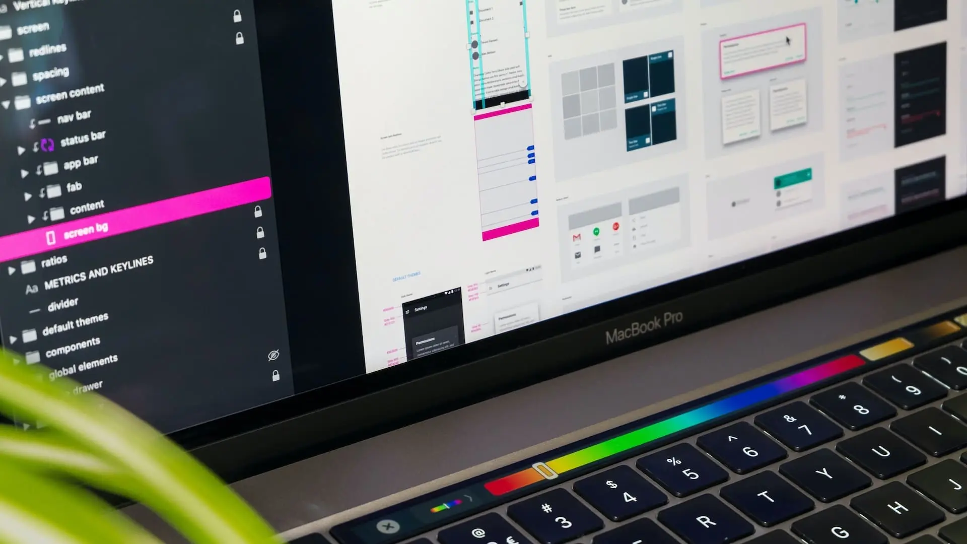 macbook with design software on screen