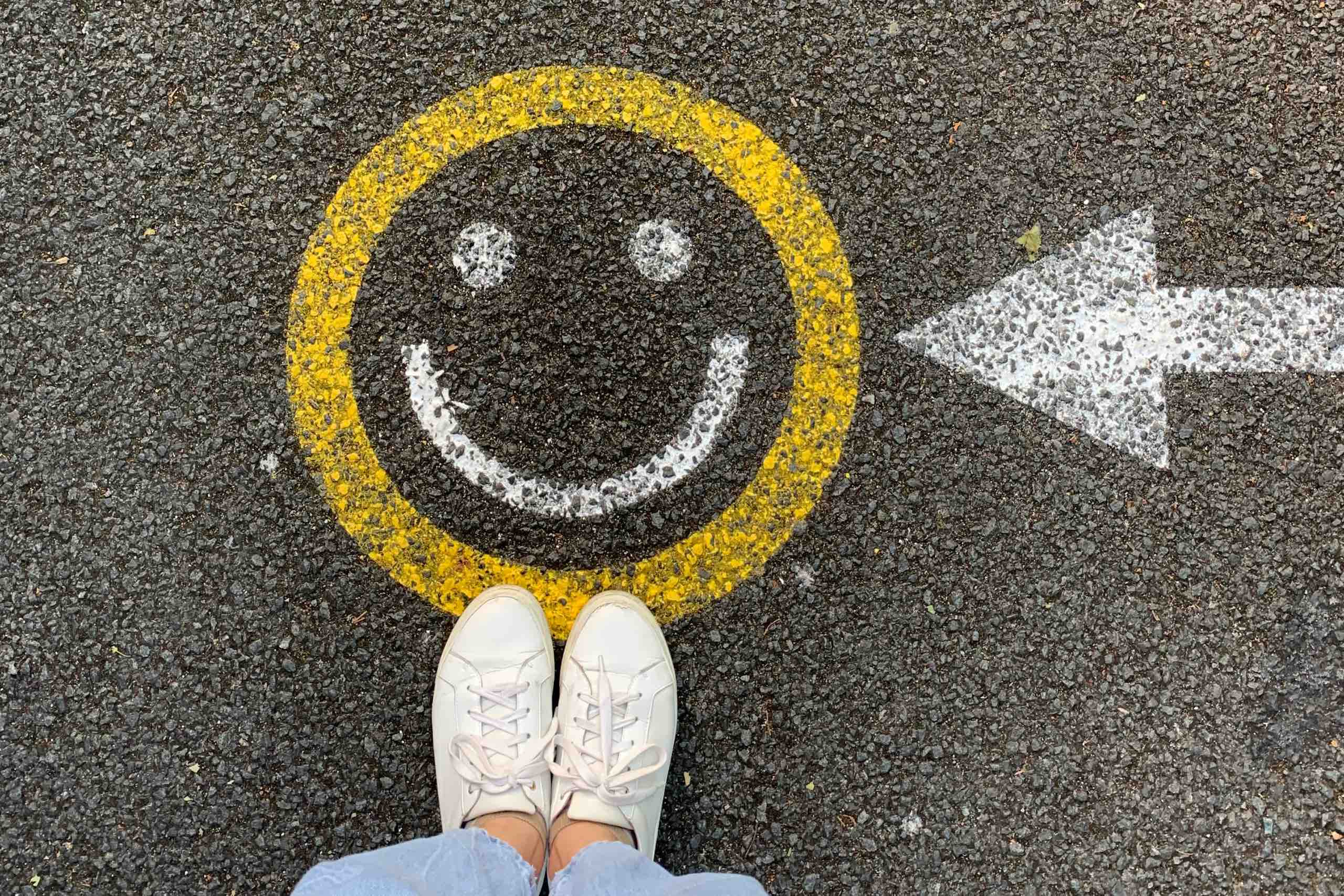 smiley face painted on pavement